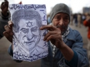 Cairo protesters hold portraits of Mubarak with a Star of David