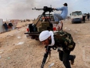 Gadhafi forces battle rebels in key eastern Libya oil port