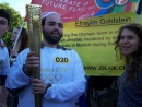 Founder of London Shomrim carries Olympic torch