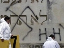 Anti-Semitic tags on the wall of a synagogue in eastern France