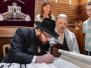 Syrian refugees take part in welcoming ceremony of a new Torah Scroll in Berlin synagogue