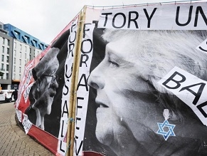 Labour supporters removed anti-Semitic banners showing Theresa May wearing a Star of David