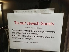 Swiss hotelier sorry for signs telling Jews to shower before entering pool